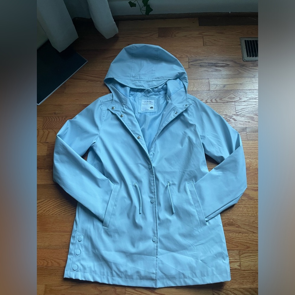 light blue rain jacket from primary size 14-15 years in good condition